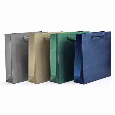 China Recycled Materials Wholesale Customize Kraft Paper Jewelry Paper Gift Bags With Your Own Logo Printed Stamping for sale