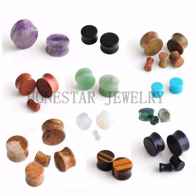 China Ear stretcher tunnel saddle plug punk stone candle for sale