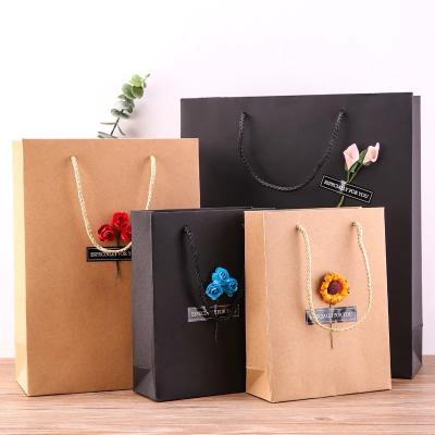 China Recyclable Printed Your Own Logo Cardboard Black/Brown Luxury Gift Craft Wine Wrapping Paper Flower Kraft Paper Bag With Logo Custom for sale