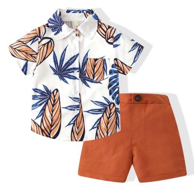 China Sports wear New boys' summer clothes 2023 European and American tide fan coconut beach short-sleeved shirt shorts two-piece foreign trade ch for sale