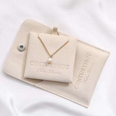 China Luxury Custom Ivory Microfiber Jewelry Packaging Bags Necklace Package Bag With Button, Velvet Jewelry Pouch With You Logo for sale