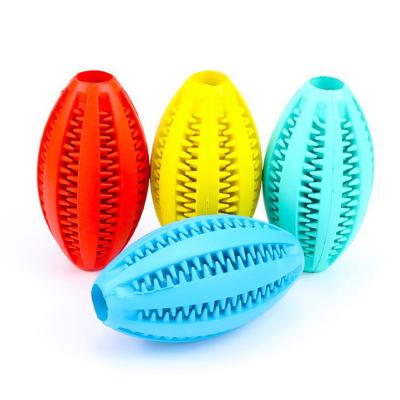 China Viable Grinding Teeth and Food Toys Rugby Shape Pet Toy BallRubber Leakage Cleaning Teeth for sale