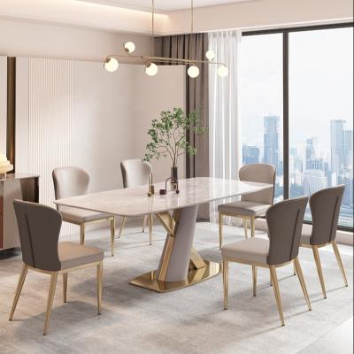 China Customized light luxury marble dining table 2023 modern simple table and chair combination small Italian minimalist home apartment for sale