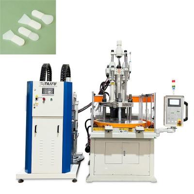 China Silicone Facial Mask Brush Making Machine Rotary Vertical Injection Moulding Machine for sale