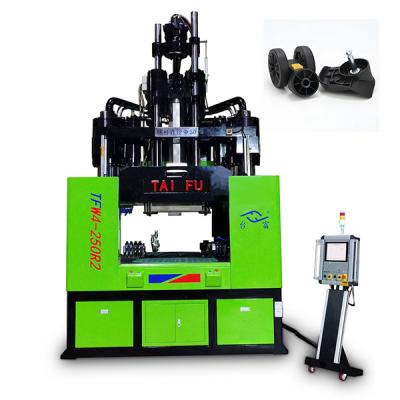 China 250 Ton Low Work Table Vertical Injection Molding Machine For Making Luggage Wheels for sale