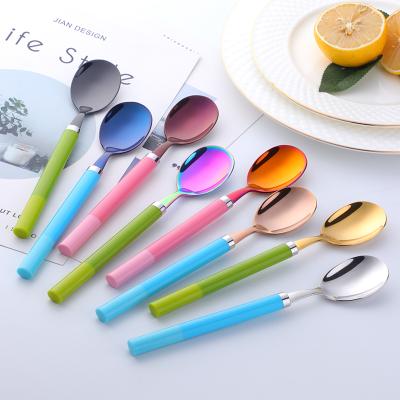 China Food Grade Durable Smooth Plastic Handle Kids Serving Spoon With Colorful Stainless Steel School Spoon for sale