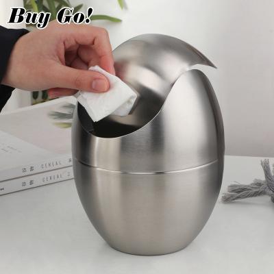 China Small Viable Shaped Trash Can Egg Wast Container Gold Stainless Steel Desktop Trash Can With Rolling Cover for sale