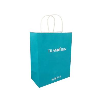 China Recycled Materials Blue Printed Kraft Paper Shopping Designer Tote Bag With Twist Handle for sale