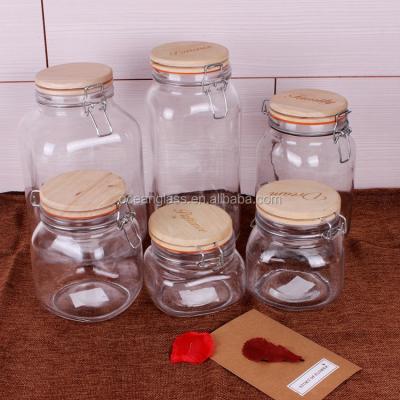 China Freshness Preservation Home Storage Mason Lid Wooden Jar 500ml 750ml 1000ml 1500ml Glass Container With Metal Clip for sale