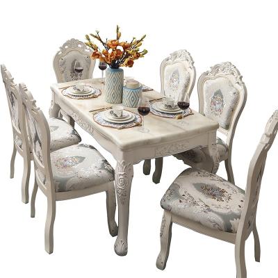 China Marble / Foshan Dining Set Luxury French Romantic Rock Top Hand Carved Solid Engraving Dining Table And Chairs Wooden Structure Marble Table for sale