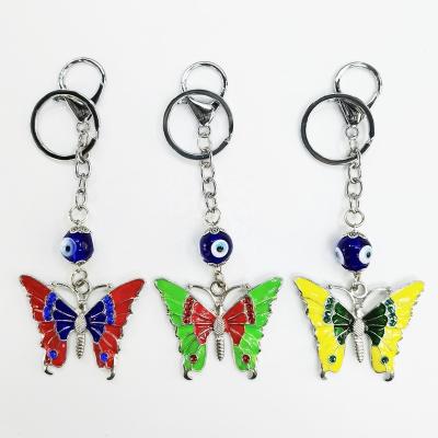 China Hanging Key Chain Butterfly Evil Eye Key Chain For Backpack Pendants Palm Drop Oil Key Chain for sale