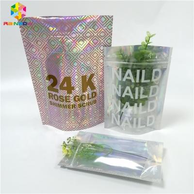 China Soft Packaging Stand Up Pink Glitter Hologram Smell Proof Transparent Hot Stamping Bags With Marks for sale