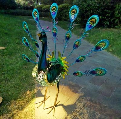 China Hand Metal Painting Lit Peacock Solar Lighting Outdoor Garden for sale