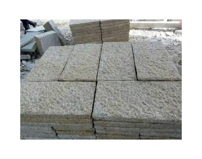 China Modern Light yellow natural handmade rough stone granite outdoor landscape wall paving for sale