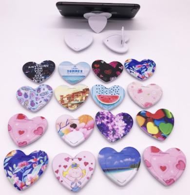 China 2020 Amazon Cheapest Wholesale Sublimation Sockets Adjustable Hot Selling Mobile Phone Holder Of Empty Heart Shape for sale