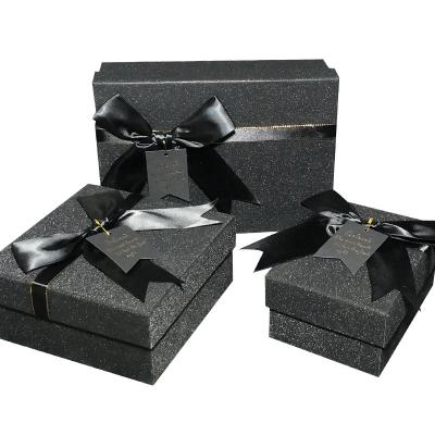 China Custom Recycled Materials Black Cardboard Hair Extension Flat Paper Packaging Gift Box With Ribbon for sale