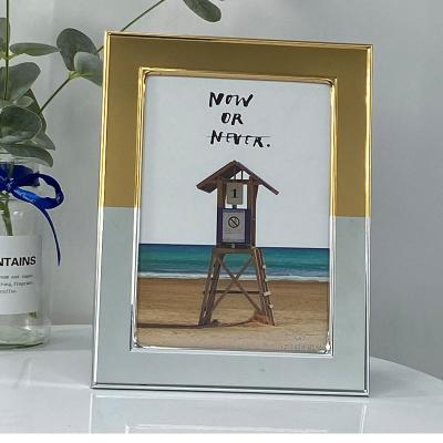 China Hot Selling Durable Eco-friendly Silver Plated Metal Stamping Frame Design Floating Wedding Gifts Stick Photo Frame for sale