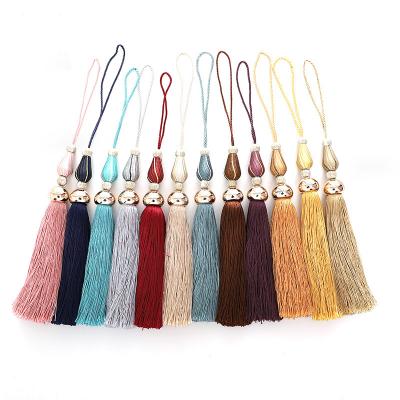 China Universal curtain hooks ball new style tassel bandage foreign trade silver curtain ornament small tassel tie rope hooks ball for sale