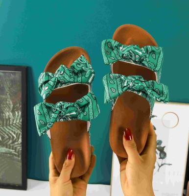 China Bowknot Fashion Trend Insti Straps Hottest Floral Bowknot Women Summer Sandals Double Slides Double Straps Women Beach Slippers for sale