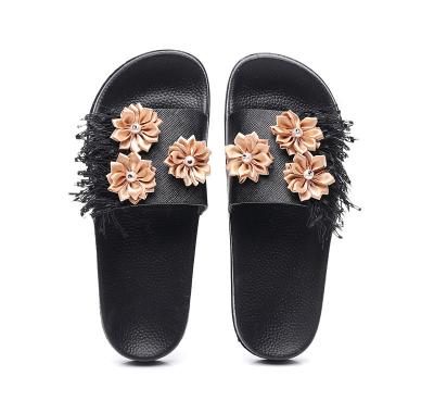 China Fashion Trend New Europe And America Style Large Size Flats Beach Fashion Flower Tassel Women Outdoor Slippers Slippers for sale