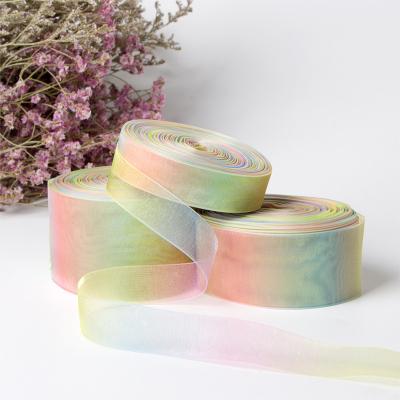 China Rainbow Tenacity Ribbon 0.3-7.5cm High Thermal Colored Transfer Gradient Transparent Snow Yarn Ribbon for sale