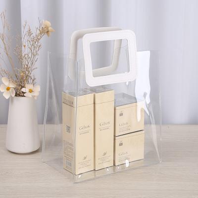 China Clear Logo Gift Package Custom Handled PVC Handle Shopping Bag For Shampoo And Conditioner for sale