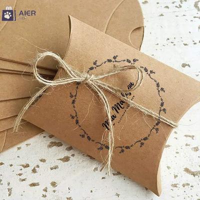 China Creative Recycled Materials Kraft Paper Pillow Box Wedding Candy Box With Hemp Rope Beef Card Black White Card Box for sale