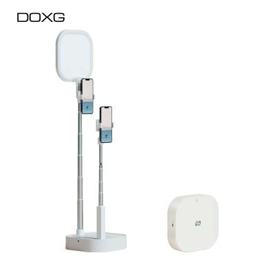 China Doxg V8 Simple Design Simple Design Selfie Multifunctional Adjustable Portable Led Desk Ring Light Phone Stand Holder With Light for sale