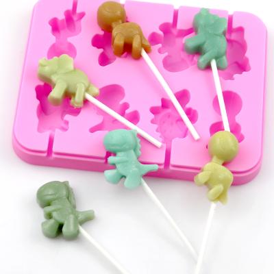 China 908 Disposable Ready To Ship 8 Holes Dinosaur Shape Lollipop Silicone Mold Silicone Chocolate Molds With 20 Pcs Sticker for sale