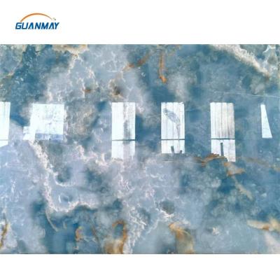 China Modern Onyx Stone Wall Panel Sky Blue Onyx Marble Natural Blue Backlit Gold Slab for sale