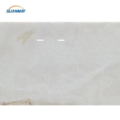 China Modern snow white onyx paper matched backlit white marble onyx red pink stone top panel thin bar panel for sale