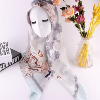 China Printing Patterns Beautiful Printed Bawal Muslim Headscarf Women Hijab Headscarf Corn Skin Tudung Head Hijab for sale