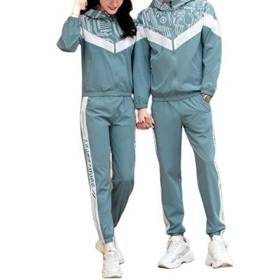 China Spring 2021 Breathable Couples Zipper Casual Set Plus Size Jacket And Pants Hooded 2 Piece Tracksuit for sale