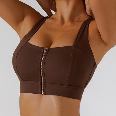 China Breathable High Quality Custom Sexy Women Gym Running Training Workout Fitness Yoga Crop Tops Front Zipper Crossed Back Yoga Sports Bra for sale