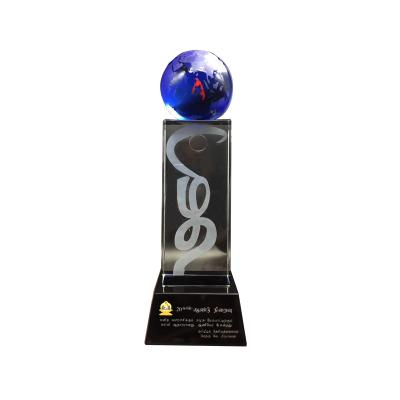 China Health Care Institute New Design Luxury 3D Lasered Engraved Crystal Glass Globe Award Trophy With Custom for sale