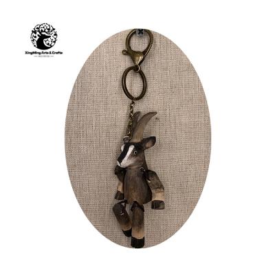 China Europe And America Manufactures Direct Selling Animal Wood Carving Key Chain for sale