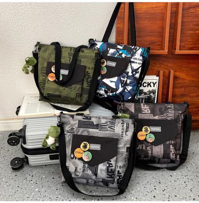 China Fashion Messenger Bags Nylon Messenger Bag Fashion Bag For Women Men Junior High School Students Camouflage for sale