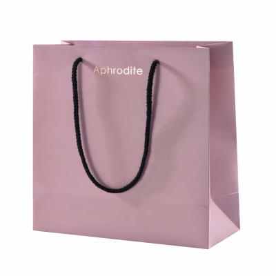 China OEM Recyclable Pink Coated Paper Production No Minimum Customized Printing Paper Shopping Bags With Your Own Logo for sale