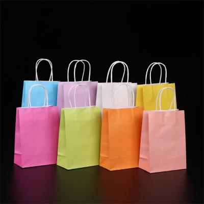 China Wholesale Cheap Recyclable Natural Brown Kraft Paper Handle Bag, Single Color Draw Party Gift Candy Paper Bag for sale