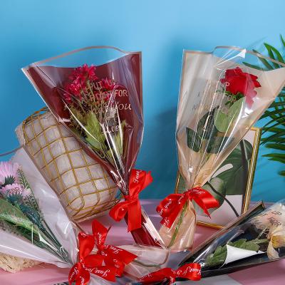 China Hot Sale Colorful Candy Flower Plastic Wrapping Valentine's Day Couples Rose Paper Bag for sale