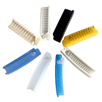 China Plastic Wholesale small disposable color travel folding plastic hair combs for sale