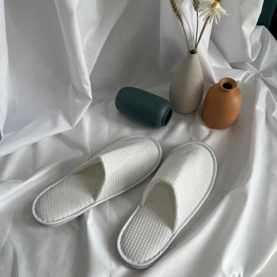 China Custom Made Professional Disposable Waffle Slippers Cotton Hotel Spa Disposable Personalized White Slippers For Guest for sale