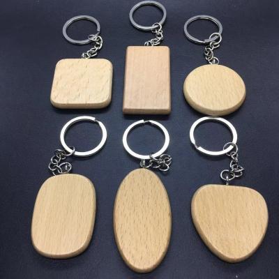 China Advertising-Wholesale Promotional Engraved Keychain Wood Made Logo Handmade Wooden Novelty Keychain Custom Made for sale