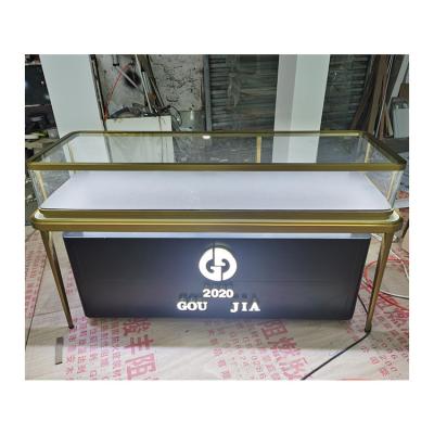 China Luxury Stainless Steel Jewelry Counter Brand Chain Stores Jade Jewelry Counter Clock Glass Display Cabinet Customize for sale