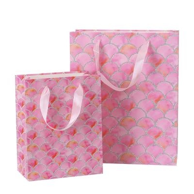 China Recyclable Custom Luxury Pink Paper Gift Packaging Bag Personalized With Printed Logo for sale