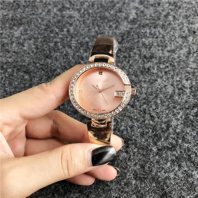 China Automatic Date Watches Women Bracelet Quartz Analog Alloy Stainless Steel Vintage Watches Vogue Bracelet Watches With Feather Charm for sale