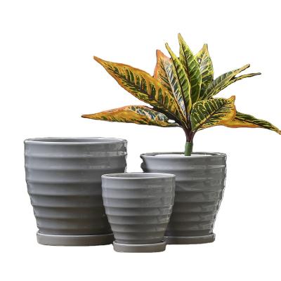 China OEM Contemporary Ceramic Flower Pot With Spiral Shape Outdoor Planter With Tray Cheap Plants Grow Flower Pot for sale