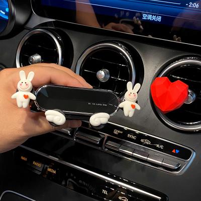 China Universal car accessories car mobile cute holder air conditioning air vent decoration GPS navigation frame fixing bracket for sale