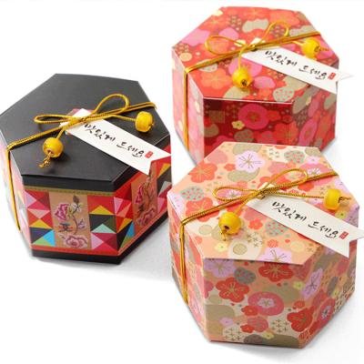 China Cute In Stock Colorful Hexagonal Tea Cans Wedding Candy Chocolate Box Plum Gift Paper Box for sale