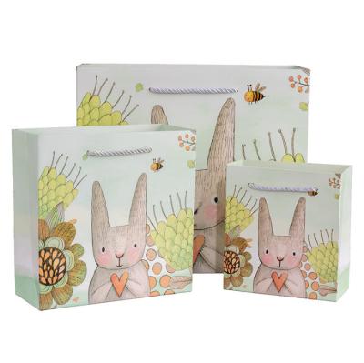 China Recycled Materials OEM Wholesale Price Customized Paper Bags Kids Gift Bags Cute Rabbit Packaging Bags With Handle for sale